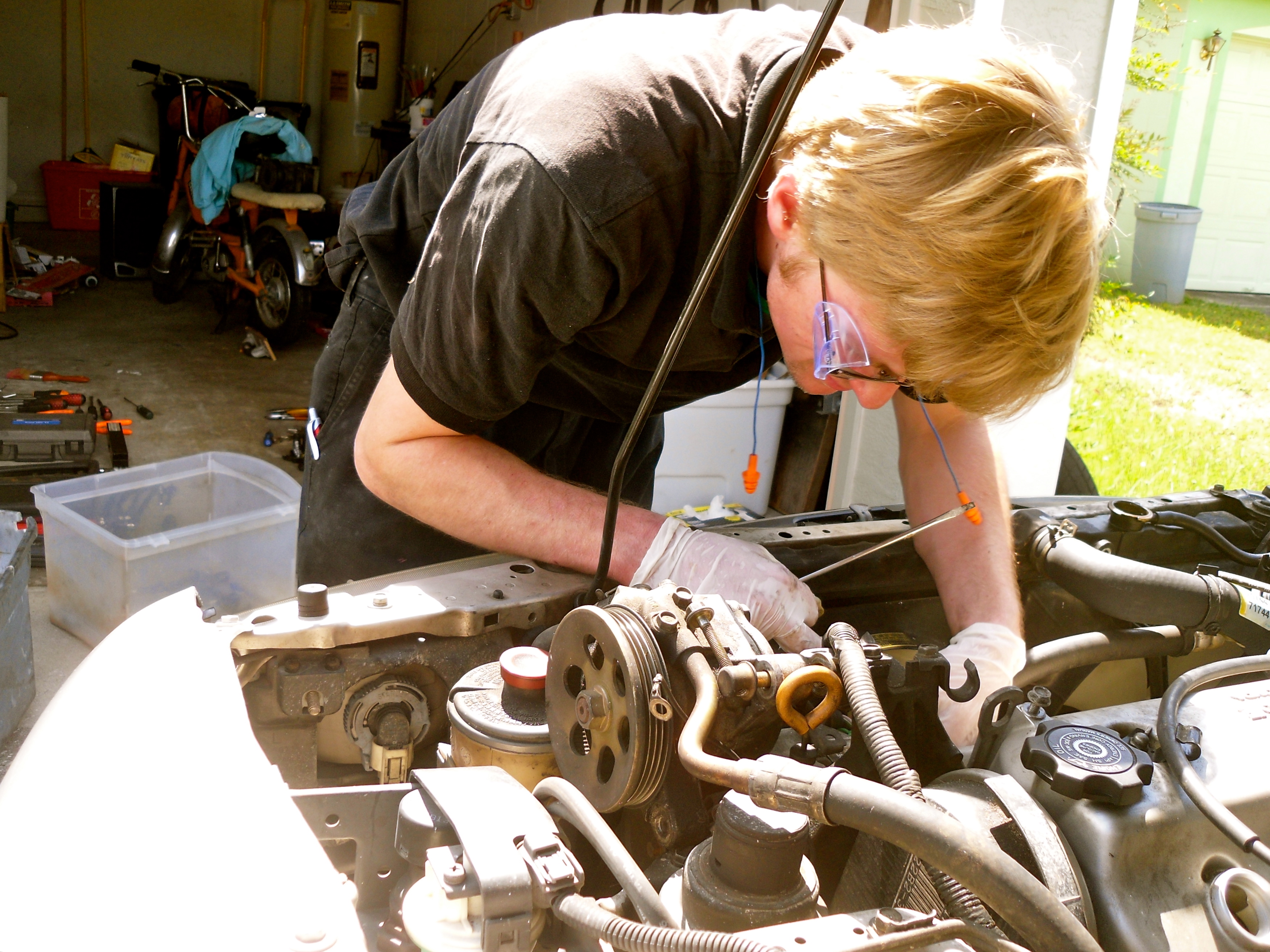 Andrew working on his car in our driveway
